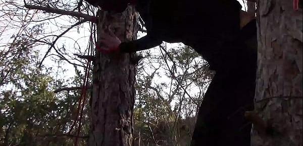 Tied up to a tree outdoor on sexy clothes, wearing pantyhose and high ankle boots heels, rough fuck